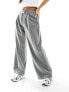 Фото #3 товара Miss Selfridge Petite slouchy wide leg pinstripe trousers with extended tab detail in light grey