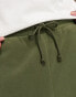 ASOS DESIGN tapered fleece joggers in green