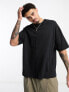 ASOS DESIGN oversized t-shirt in black with back text print