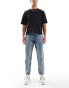 ASOS DESIGN tapered fit jeans with vintage tint in mid wash blue - MBLUE