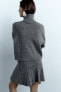 Pleated knit mini skirt