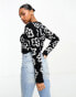 Фото #4 товара Monki fluffy knit shrunken long sleeve sweater in black mono floral jacquard