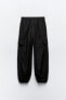 Nylon trousers with zips