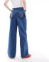 Neon Rose wide leg jeans with cherry applique pockets in mid blue