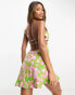 ASOS DESIGN halter mini beach dress with cut out waist in smudge print