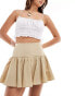 Фото #1 товара ASOS DESIGN dropped waist cotton mini skirt in khaki