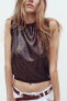 SLEEVELESS SEQUINNED KNIT TOP