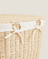 Oval fabric-lined laundry basket