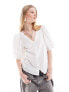 Monki volume short sleeve v neck blouse with open back heart detail in white