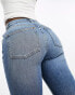 Фото #4 товара ASOS DESIGN Hourglass mid rise flare jeans in mid blue