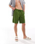 ASOS DESIGN swim shorts in long length in green