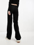 Monki low waisted trousers with side buckle detail in black