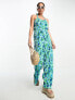 Фото #1 товара Monki jersey plisse cross back detail jumpsuit in blue and green flower print