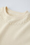 Sweatshirt with faux pearl neck