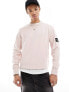 Фото #1 товара Calvin Klein Jeans badge crew neck sweatshirt in sepia rose