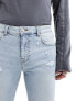 ASOS DESIGN skinny jeans with rips in light blue tinted wash