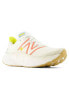 New Balance More running trainers in white and orange with gum sole