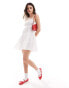 Фото #1 товара Wednesday's Girl textured shirred mini smock dress in white