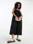ASOS Design – Trapezförmiges Latzhosen-Sommerkleid aus Baumwolle in Schwarz