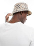 Karl Kani signature reversible bucket hat in beige paisley