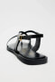 STRAPPY FLAT SLIDER SANDALS WITH METAL EMBELLISHMENT