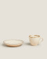 Porcelain coffee cup with antique finish rim