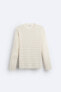 Textured open-knit sweater