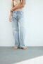 Trf slouchy mid-rise jeans with tab detail