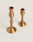 Thin golden candleholder