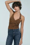 BUCKLED PATENT HALTER TOP