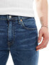 Фото #14 товара Levi's 502 taper fit jeans in mid blue