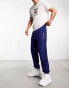 Nicce split logo jersey joggers in navy