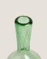 Coloured blown glass bottle