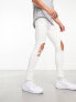 ASOS DESIGN spray on jeans with power stretch with heavy rips in white