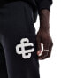 The Couture Club co-ord heavyweight emblem joggers in black