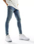 Фото #2 товара ASOS DESIGN spray on jeans with power stretch in tinted wash blue