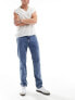 Фото #1 товара Tommy Jeans Ethan relaxed straight leg jeans in mid wash