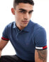 Tommy Hilfiger logo cuff slim fit polo in mid blue