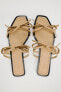 Flat slider sandals with bows