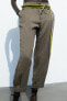 Trousers with pleated hems