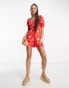 ASOS DESIGN milkmaid playsuit in red daisy print