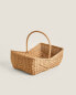 Woven rattan basket with handle