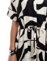 Monki tie waist jumpsuit in black and white puzzle print