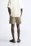 Textured mesh bermuda shorts