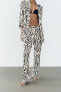 Straight fit snakeskin print trousers