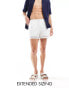 ASOS DESIGN swim shorts in short length with side hem details in white