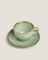 Porcelain teacup with antique finish rim