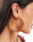 Accessorize large hoop earrings in gold