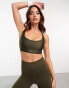 Puma Running Evolve medium support sports bra in khaki