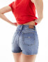 Tommy Jeans denim shorts in mid wash